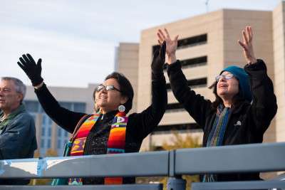 Rev. María Cristina Vlassidis Burgoa (left) Interim Second Minister at First Parish in Brookline, joins in singing  to support the immigrants detained in the Suffolk County House of Corrections Sunday. PHOTO BY MIKE DESOCIO/DAILY FREE PRESS STAFF