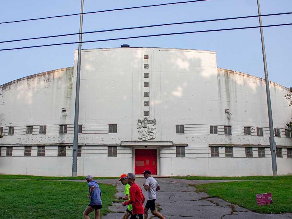 Runners in front of White Stadium in Franklin Park. White Stadium will be renovated ahead of plans for a new Boston team in the National Women’s Soccer League for 2026. SEAN YOUNG/DFP PHOTOGRAPHER