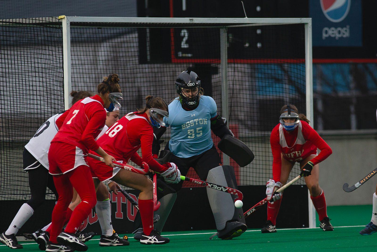 Senior goalkeeper Livy Golin (center) in a game against Northeastern University on April 5. Golin, who started in-goal for the Terriers against American University on Saturday, was honored during Senior Day festivities. MATTHEW WOOLVERTON/ DFP FILE
