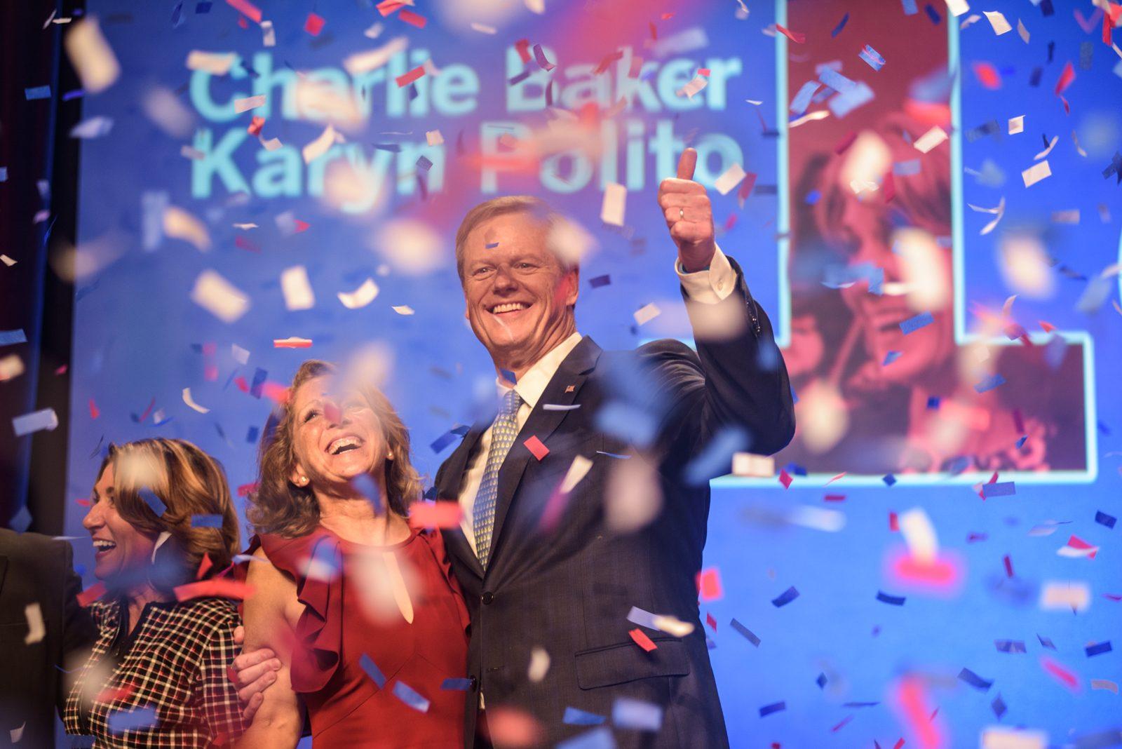 Massachusetts Gov. Charlie Baker celebrates re-election on Nov. 7 with his wife Lauren Baker and running mate Karyn Polito (far left). Baker consistently ranks as the most popular governor in the country. CHLOE GRINBERG/ DFP FILE 