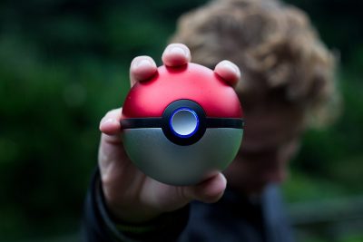 person holding a poke ball