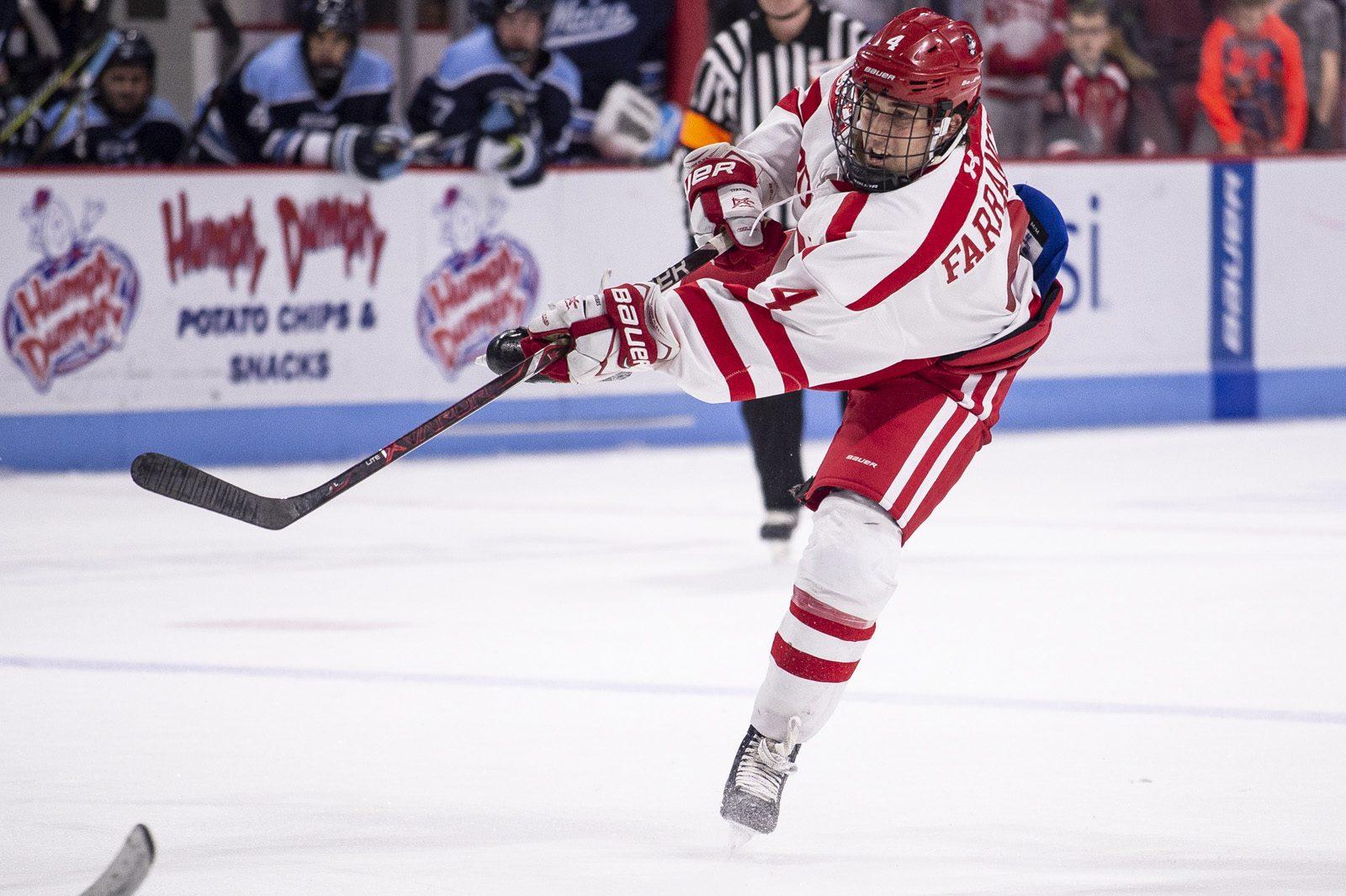 Sophomore defenseman David Farrance shoots the puck during third period action. PHOTO BY MADDIE MALHOTRA/ DAILY FREE PRESS STAFF
