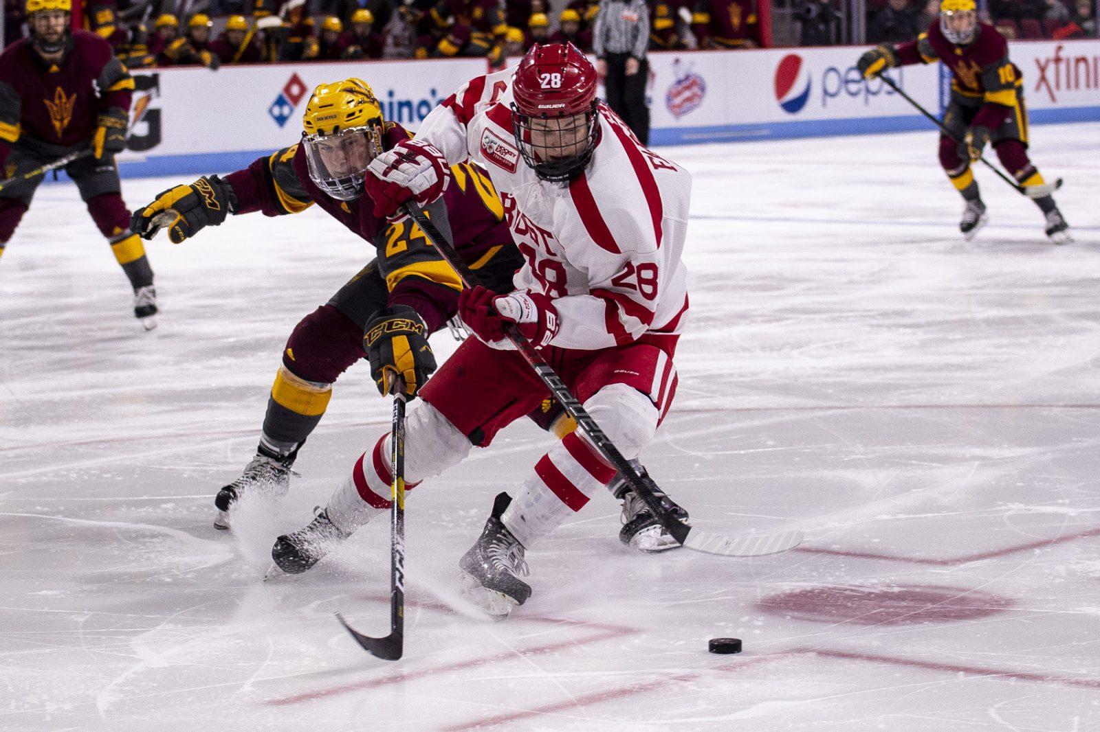 Freshman forward Joel Farabee goes up against Arizona State defenseman Josh Maniscalco during the third period Friday night at Agganis Arena. PHOTO BY MADDIE MALHOTRA