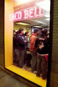 A line of people winds through the Taco Bell at Warren Towers, as students grab one last fast-food meal. PHOTO BY Brooks Canaday