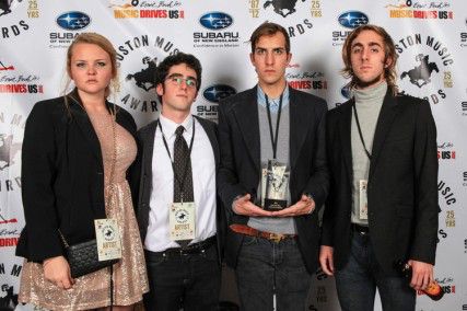 Allston Pudding staff manager Ellie Moliter and co-founders Daniel Schiffer, Perry Eaton and Jarrett Carr accept an award at the Boston Music Awards in 2012. PHOTO COURTESY OF ALLSTON PUDDING