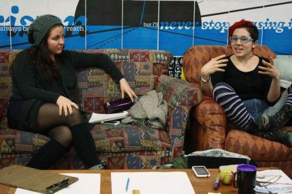 College of Arts and Sciences senior KC Mackey discusses ideas of how to spread knowledge about gender-neutral housing on campus with College of Arts and Sciences junior Chelsea Schwalm, who facilitates the Gender Neutral BU meeting at the Center for Gender, Sexuality, and Activism Tuesday night. PHOTO BY MAYA DEVEREAUX/DAILY FREE PRESS