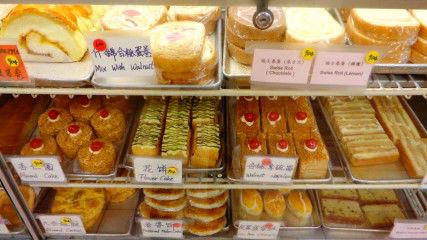 A display case (left) and the counter at Eldo Cake House. The small shop at 36 Harrison Avenue is renowned for its “gooey and flaky and absolutely perfect” egg custard tarts. Noëmie Carrant/ Daily Free Press Staff