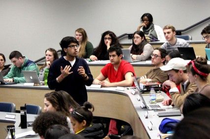 College of Arts and Sciences freshman Saurabh Mahajan, director of advocacy for Student Government, fields questions about the proposal of extended MBTA hours at the SG meeting Monday night. PHOTO BY MADISON FRANCOSIS/DAILY FREE PRESS STAFF