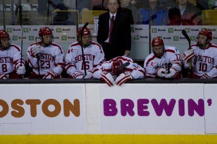 Senior captain Wade Megan hangs his head on the bench after Northeastern scores its third goal in the first game of the Beanpot at TD Garden Monday Night. PHOTO BY MICHELLE JAY/DAILY FREE PRESS STAFF