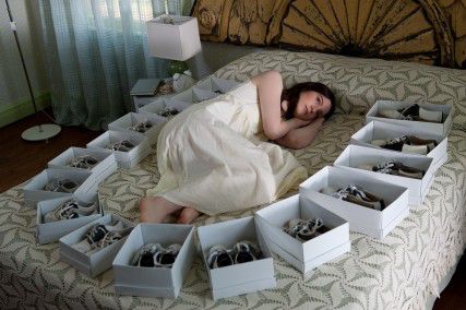 Photo Courtesy of Fox Searchlight Pictures India (Mia Wasikowska) surrounded by shoeboxes in a symbolic yet heavy-handed scene from Stoker.