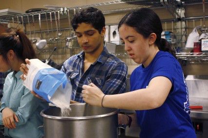 College of Arts and Sciences freshman Allison Feld and School of Management junior Rick Anderson mix ingredients to make Challah to sell for Challah for Hunger at the BU Hillel December 4, 2012. PHOTO BY SARAH FISHER/DAILY FREE PRESS FILE