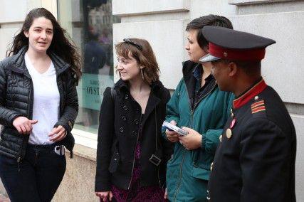 College of Arts and Sciences sophomore Talia Leonard and other Boston University students talk to Hotel Commonwealth doorman Zelalem W. about his job in relation to the recent allegation of unfair firing practices at the hotel. PHOTO BY NEEL DHANESHA/DAILY FREE PRESS STAFF