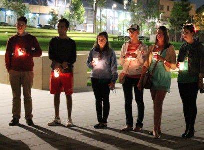 Participants in the Boston University Sydney program hold a moment of silence Wednesday in honor of the Boston Marathon tragedy. PHOTO BY AMY GOREL/DAILY FREE PRESS STAFF