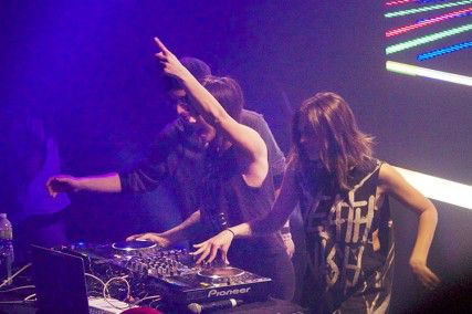 Krewella  members Rain Man, Yasmine Yousaf and Jahan Yousaf, from left to right,  crowded together on the Royale stage. SYDNEY MOYER/DAILY FREE PRESS STAFF