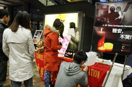 Students line up to make donations Monday evening at the George Sherman Union Link toward those who are suffering from a recent earthquake in China during the memorial to honor Lingzi Lu, the Boston University graduate student from China who died in the Boston Marathon bombings. PHOTO BY MAYA DEVERAUX/DAILY FREE PRESS STAFF