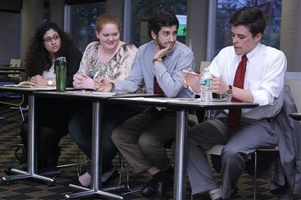 Student Government presidential candidate Luke Rebecchi of Can't B Without U answers the moderator's question with his party members at the SG debate Tuesday evening at the GSU. PHOTO CREDIT MAYA DEVERAUX/DAILY FREE PRESS STAFF