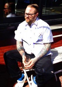 Chef Jamie Bissonnette lounges outside his South End restaurant, Coppa.