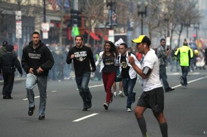 Spectators flee after an explosion near the finish line of the Boston Marathon KENSHIN OKUBO/ DAILY FREE PRESS STAFF