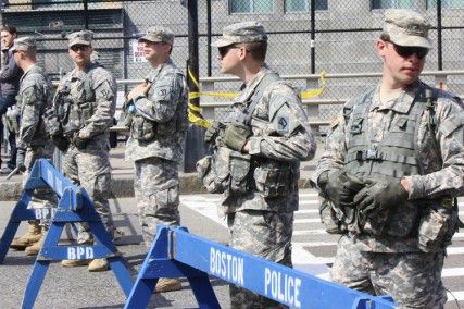 Military officials guard the Boylston Street at the Massachusetts Avenue intersection Tuesday afternoon while the investigation into the explosions at the finish line of the Boston Marathon continues. PHOTO BY SARAH FISHER/DAILY FREE PRESS STAFF