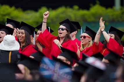 BU graduates cheer during Boston University's Commencement ceremony Sunday afternoon at Nickerson Field. PHOTO BY KENSHIN OKUBO/DAILY FREE PRESS STAFF 