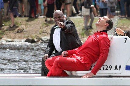 Dean of Students Kenneth Elmore smiles at students after jumping into the Charles River Friday morning, along with College of Communication senior and Senior Class Gift Committee Co-Chair Mike DeFilippis. PHOTO BY MICHAEL CUMMO/DAILY FREE PRESS