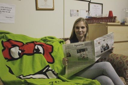 Editor-in-Chief Emily Overholt with just another issue of The Daily Free Press MICHELLE JAY/DAILY FREE PRESS STAFF