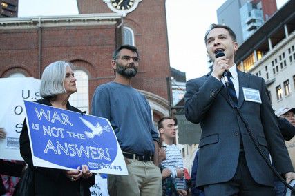 Carl M. Sciortino Jr., Democratic candidate in the 2013 special election for Massachusetts's 5th congressional district, rallies against a strike on Syria at a peace vigil Monday night on Park Street. PHOTO BY MAYA DEVEREAUX/DAILY FREE PRESS STAFF 