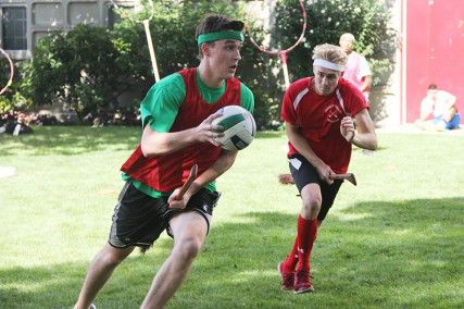 School of Management senior Brendon Stack and College of Arts and Sciences junior Brett Engwall played Quidditch Sunday afternoon behind Sleeper Hall. PHOTO BY SARAH SIEGEL/DAILY FREE PRESS STAFF