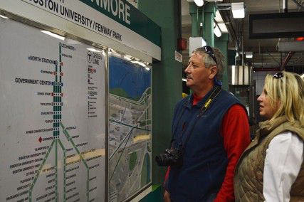 A couple looks at a map of the Green Line to Tuesday afternoon at Kenmore Station. The MBTA-hosted contest that asked Bostonians to redesign the MBTA map ended Friday, but the MBTA has not committed to replacing the maps. PHOTO BY OLIVIA HAAS/DAILY FREE PRESS STAFF