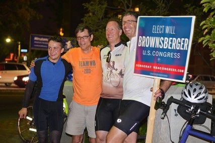 Will Brownsberger and three supporters smile after their 110-mile bike ride throughout the 5th District of Massachusetts Saturday evening in Whittemore Park. PHOTO BY HEATHER GOLDIN/DAILY FREE PRESS STAFF