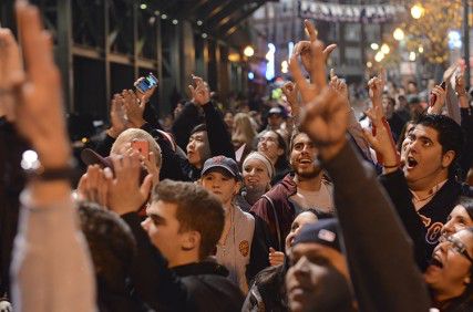 The crowd gathered and cheered for the Boston Red Sox Wednesday night outside of Fenway Park. PHOTO BY MIKE DESOCIO/DAILY FREE PRESS STAFF 