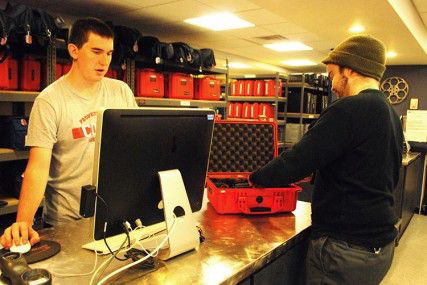 College of Communication senior Shawn Levy looks at a Canon EOS Rebel T2i before renting it from College of Communication junior Sam Hayes Wednesday morning at Field Production Services in the basement of the College of Communication. PHOTO BY FALON MORAN/DAILY FREE PRESS CONTRIBUTOR