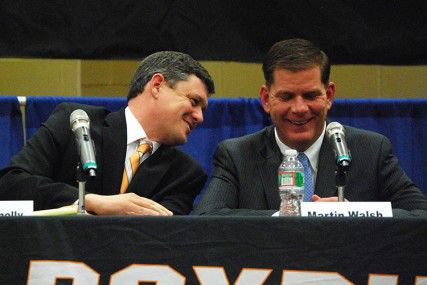 Boston mayoral candidates City Councilor John Connolly and Mass. Rep. Marty Walsh chat after the at the Communities of Color Mayoral Debate Wednesday night in the Reggie Lewis Center in Roxbury. PHOTO BY FALON MORAN/DAILY FREE PRESS STAFF