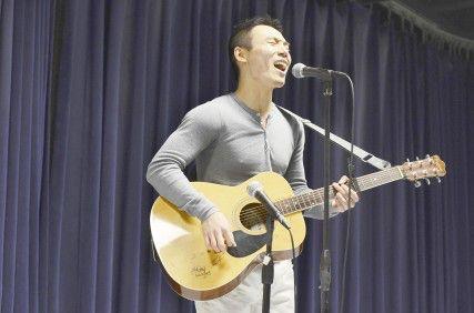 School of Management senior Simon You performs vocals and guitar at the Typhoon Haiyan Benefit Show hosted by the Boston University Filipino Student Association. PHOTO BY MIKE DESOCIO DAILY FREE PRESS STAFF