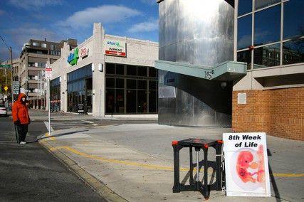 A protester who prefers to remain anonymous stands outside the 35-foot buffer zone in front of Planned Parenthood in Boston. Mass. Attorney General Martha Coakley recently filed a brief with the U.S. Supreme Court defending the buffer zone by which protesters must abide outside abortion clinics in the Commonwealth of Massachusetts. PHOTO BY EMILY ZABOSKI/DAILY FREE PRESS STAFF