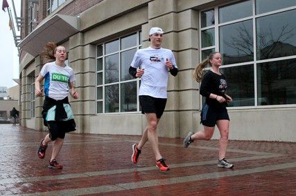 The BU Triathlon Team, including Nick Smith and Nick Wendel, lace up their sneakers for an early morning run. PHOTO BY AMY GOREL/DAILY FREE PRESS STAFF