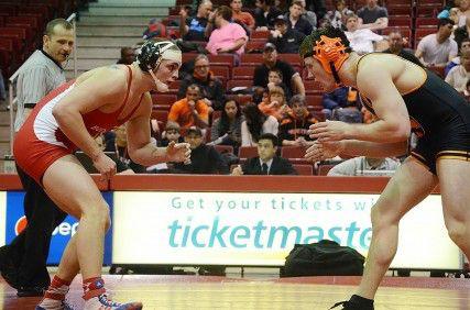 Boston University students hosted a day-long event across campus Friday involving petitions and raffles, all in an effort to save the BU wrestling program, which will be discontinued after the 2013-14 school year. PHOTO BY FALON MORAN/DAILY FREE PRESS STAFF