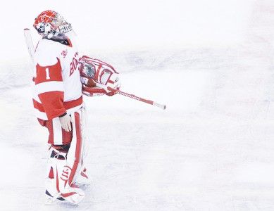 Boston University goaltender Anthony Moccia stares up at the scoreboard from center ice at the end of the consolation game of the 2014 Beanpot Tournament at T.D. Garden. PHOTO BY MICHELLE JAY/DAILY FREE PRESS STAFF