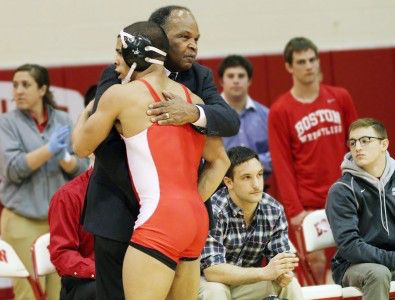 MICHELLE JAY/DAILY FREE PREES STAFF Coach Carl Adams and senior Nestor Tarffur embrace during BU's last home match.