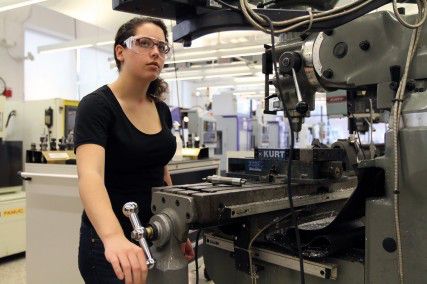 MICHELLE JAY/DAILY FREE PRESS STAFF College of Engineering senior Kiley Monahan works on a drill press in the EPIC.