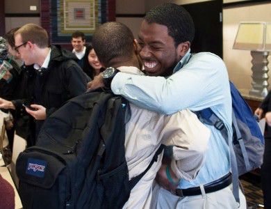 College of Arts and Sciences freshman Joshua Mosby (left) hugs a friend after BU’s Push to Start won the student government elections Wednesday evening at the George Sherman Union. PHOTO BY JUSTIN HAWK/DAILY FREE PRESS STAFF 