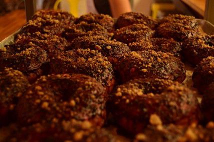 Blueberry pie doughnuts sit on display inside Mei Mei. The pastries were there for a special takeover by Stacked Donuts and Trademark Tarts. PHOTO BY BROOKE JACKSON-GLIDDEN/DAILY FREE PRESS STAFF