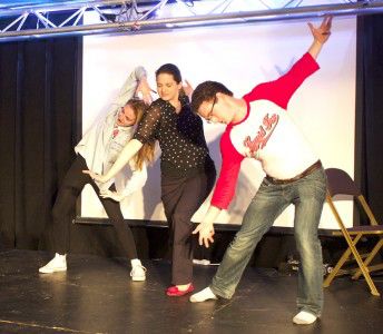 BU's Liquid Fun group improvs onstage, raising money for the Greater Boston Food Bank. PHOTO COURTESY OF COREY BITHER