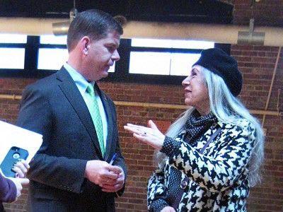 Boston Mayor Martin Walsh talked with Boston resident Pamela Siena at a ceremony Wednesday at the Parish Street Community Center during which he reflected upon his first 101 days in office. PHOTO BY MINA CORPUZ/DAILY FREE PRESS STAFF
