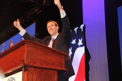 Mike Like, candidate for Lieutenant Governor, gives two thumbs up as he presents his speech to the convention body. PHOTO BY FELICIA GANS/DAILY FREE PRESS STAFF 