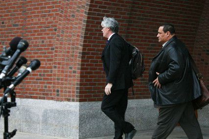 William Fick (left) and Timothy Watkins (right) leave John Joseph Moakley courthouse after a pre-trial hearing for Dzhokar Tsarnaev in November 2013. Fick and Watkins, Tsarnaev's lawyers, left without speaking to the media. PHOTO BY EMILY ZABOSKI/DAILY FREE PRESS STAFF