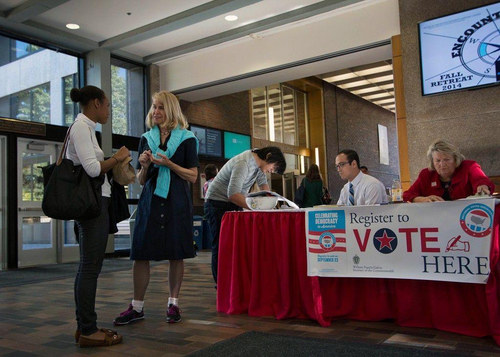 Boston Election Department representative Ellen Rooney discusses voter registration at Boston University's George Sherman Union with Tabitha Burnett (CAS ‘15). PHOTO BY NICKI GITTER/DAILY FREE PRESS CONTRIBUTOR