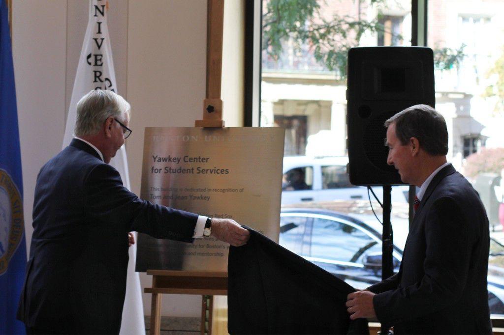 Boston University President Robert Brown and Jim Healey of Yawkey Foundations named 100 Bay State Road The Yawkey Center for Student Services at a ceremony Wednesday. PHOTO BY DREW SCHWARTZ/DAILY FREE PRESS STAFF