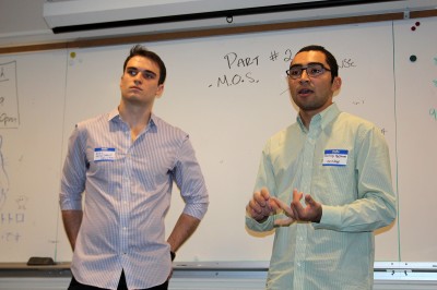 Noah Friedman (SMG ‘17) and Santiago Beltran (ENG ‘17) explain the expansion of their app, BU Food, at the BU Buzz Entrepreneurial Lab launch Wednesday. PHOTO BY MAE DAVIS/DAILY FREE PRESS STAFF