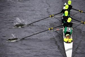 A Youth Mens Four team from Walter Johnson Crew Inc. in Bethesda, Maryland, takes directions from their coxswain as they pass under the Eliot Bridge. PHOTO BY CARLY ROSE WILLING/DAILY FREE PRESS STAFF